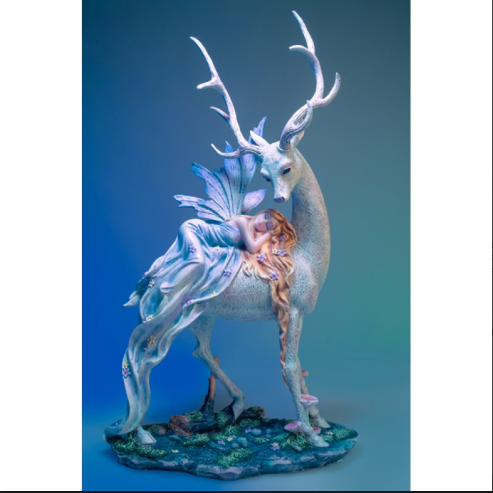 Woodland Fairy sleeping on Snow Deer Figurine